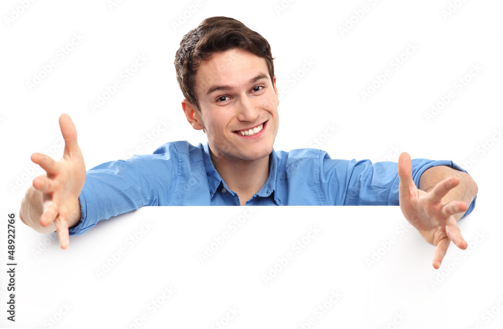 Young man with blank board