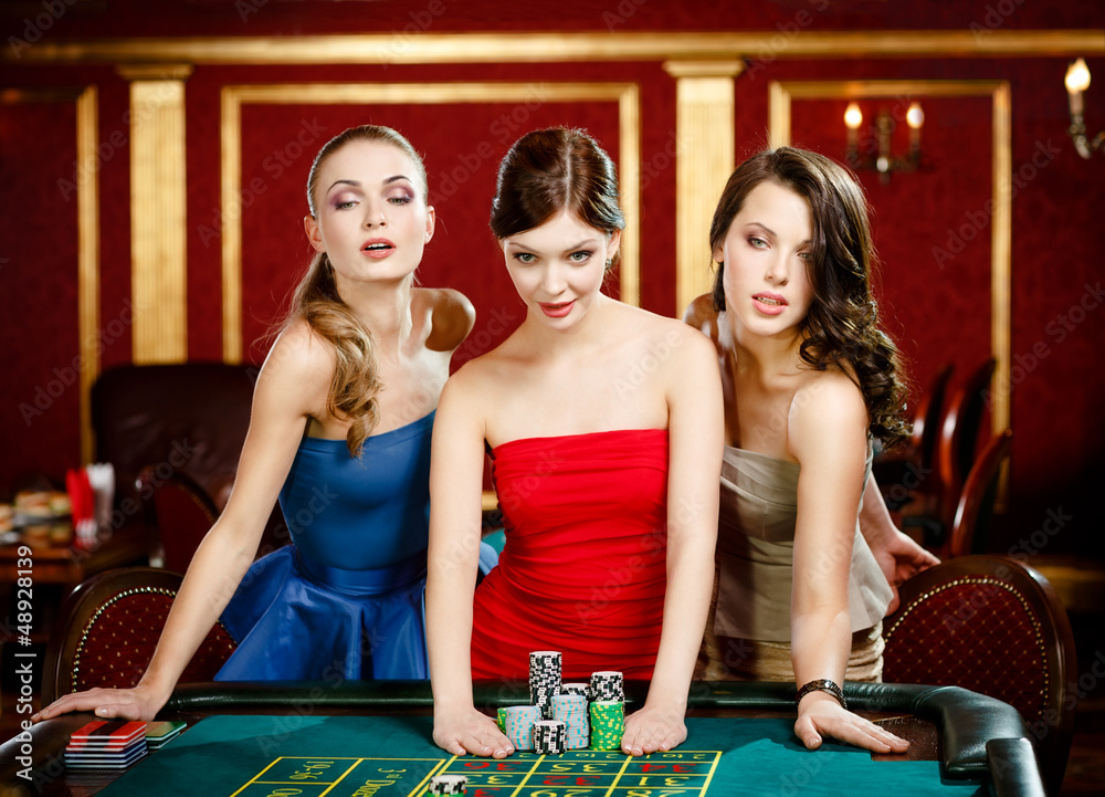 Three women bet playing roulette at the gambling house Three women bet playing roulette at the gambling house