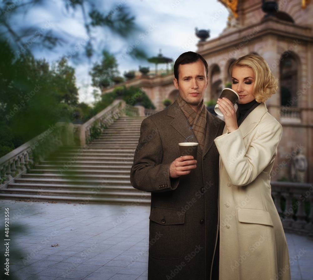 © Nejron Photo - Elegant couple outdoors with cups of hot drink © Nejron Photo - Elegant couple outdoors with cups of hot drink