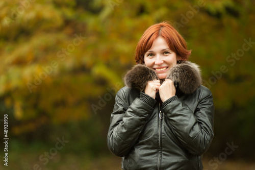 young woman portrait in autumn park