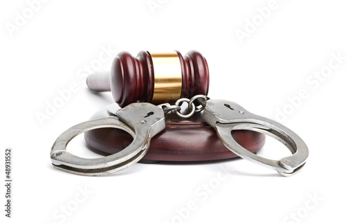 A pair of handcuffs and gavel