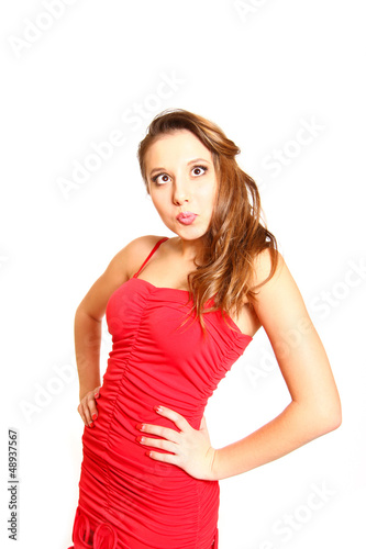 Funny girl in red dress isolated on white background © majesticca