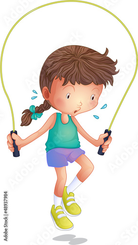 A little girl playing skipping rope