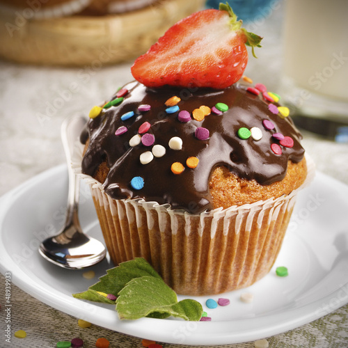 Chocolate muffin with sprinkles
