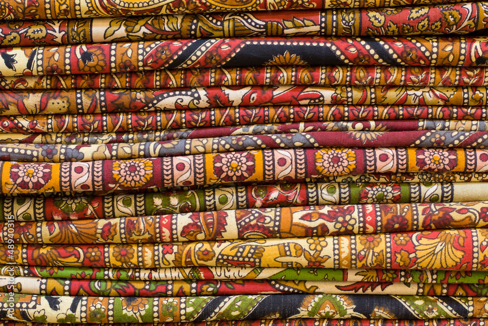 Heap of cloth fabrics at a local market in India. Heap of cloth fabrics at a local market in India.