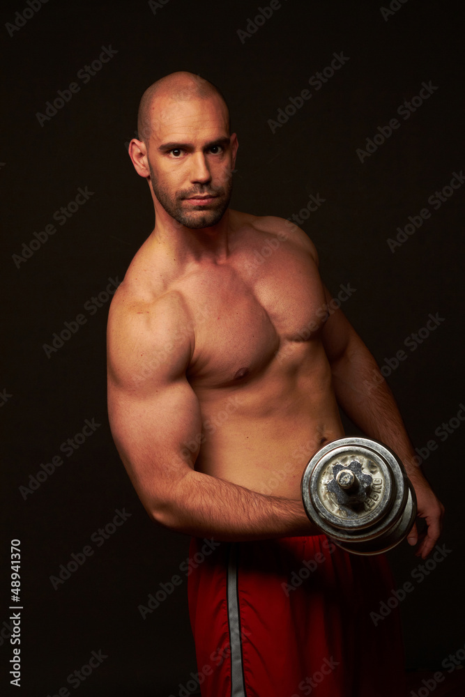 Muscular male body black background Muscular male body black background