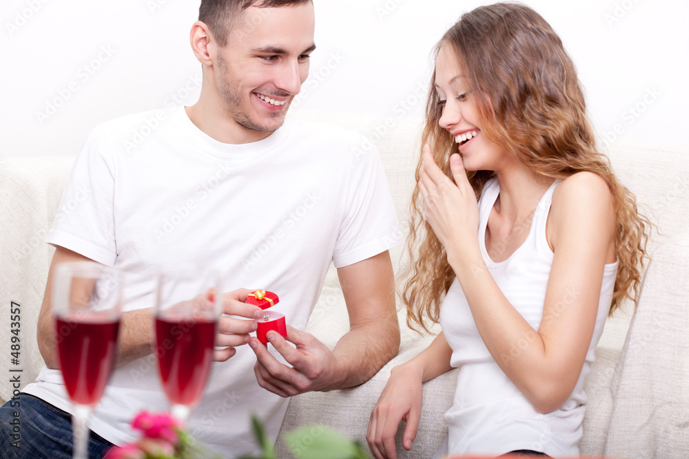 young man giving ring for his girlfriend