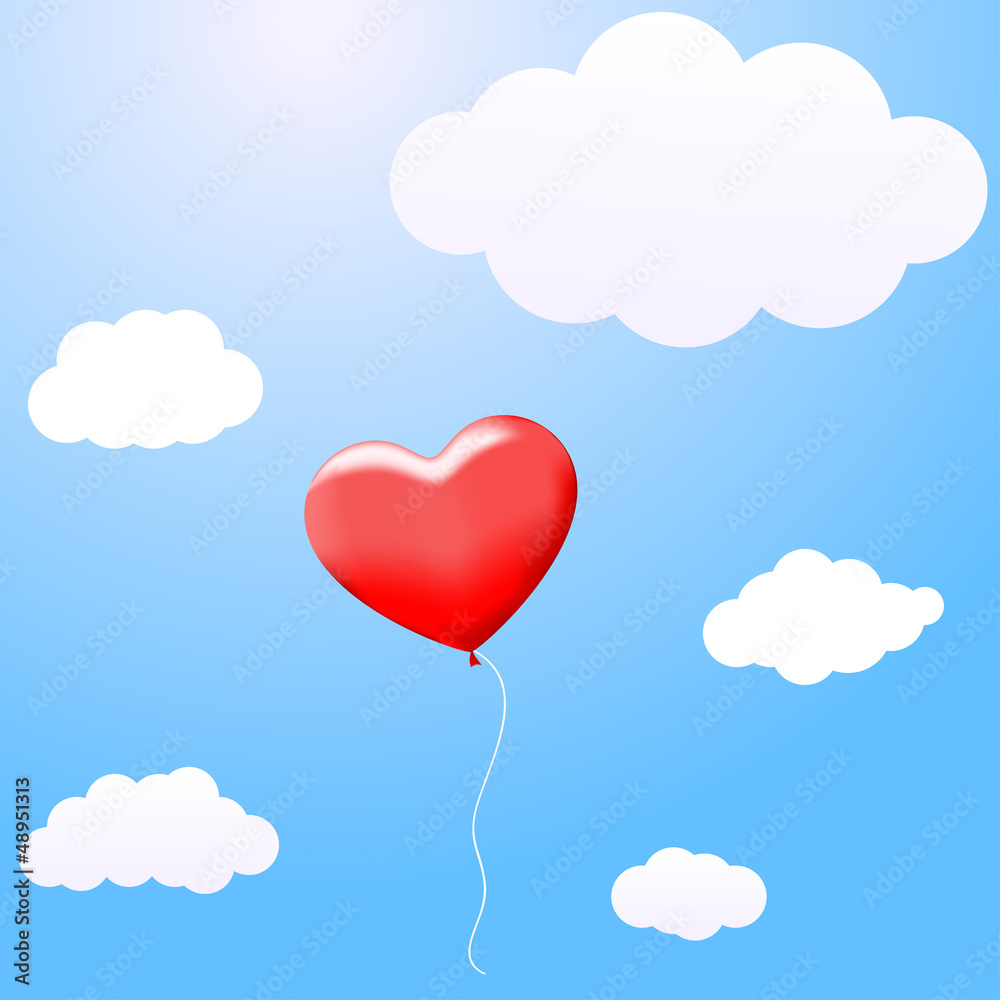 Balloon in the shape of a heart flying in the clouds