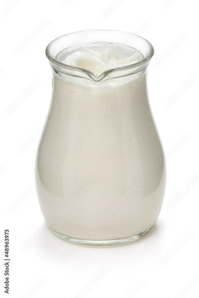 Jug with fresh milk on a white Jug with fresh milk on a white