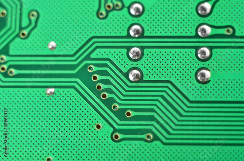 Close up of a printed green computer circuit board