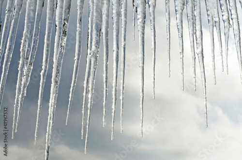 Tablou canvas Beautiful icicles on a background of clouds