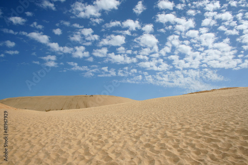 Clouds over sand dunes © mtphoto19