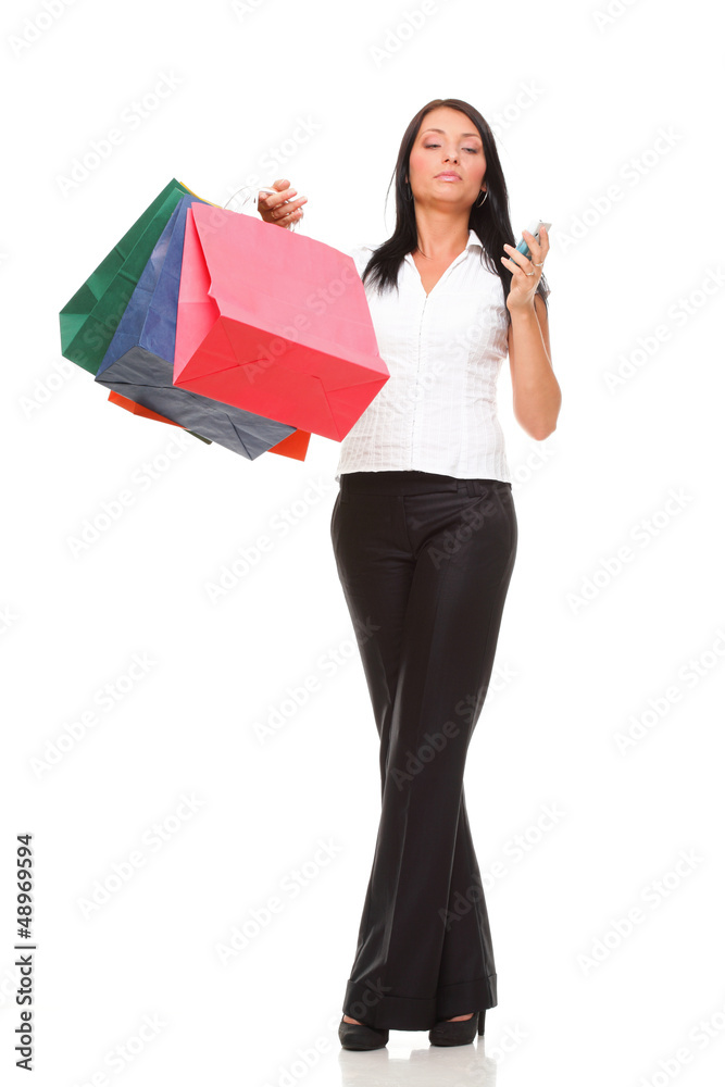 portrait cute young woman mobile phone while holding shopping ba portrait cute young woman mobile phone while holding shopping ba