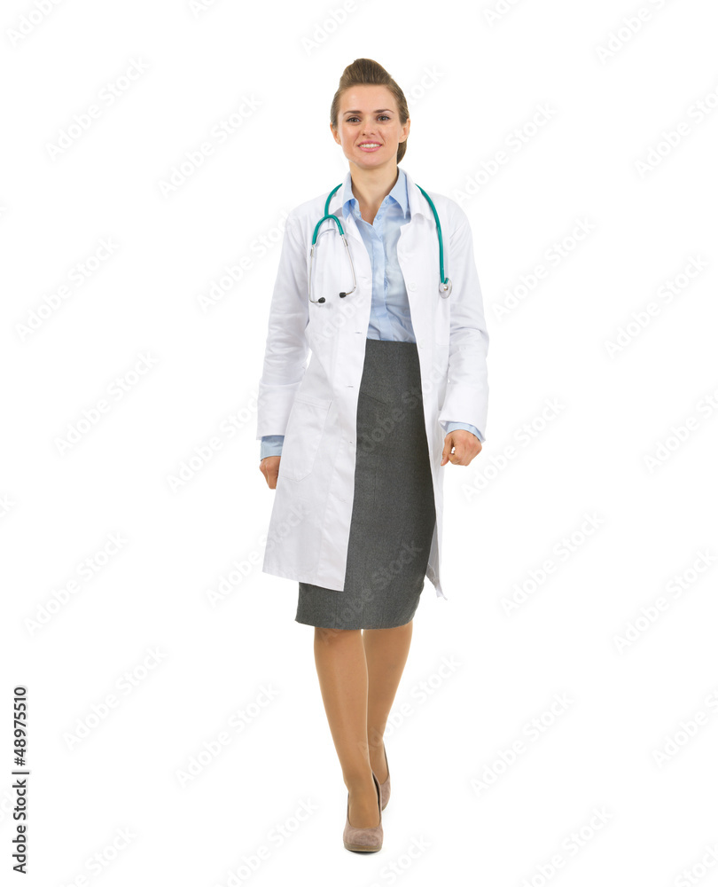 Full length portrait of medical doctor woman going straight Full length portrait of medical doctor woman going straight