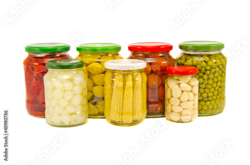 various potted vegetables glass jars isolated on white