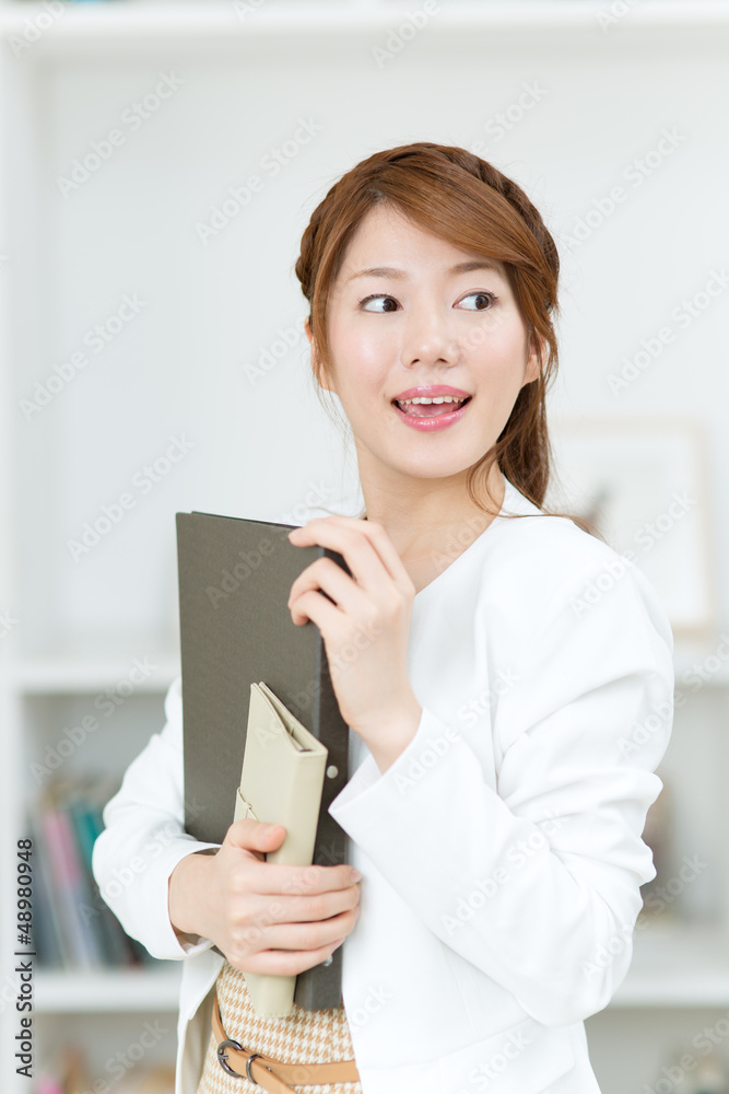Beautiful young businesswoman working in office Beautiful young businesswoman working in office