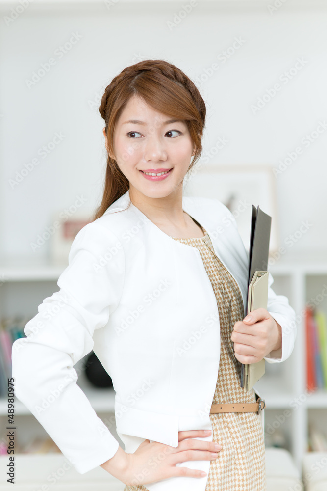 Beautiful young businesswoman working in office Beautiful young businesswoman working in office