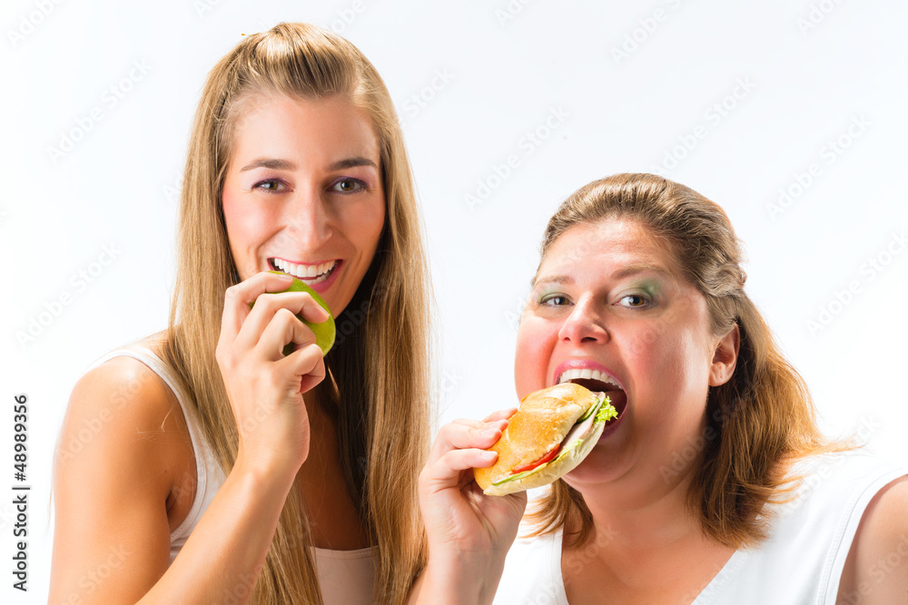 Thin and fat woman eating
