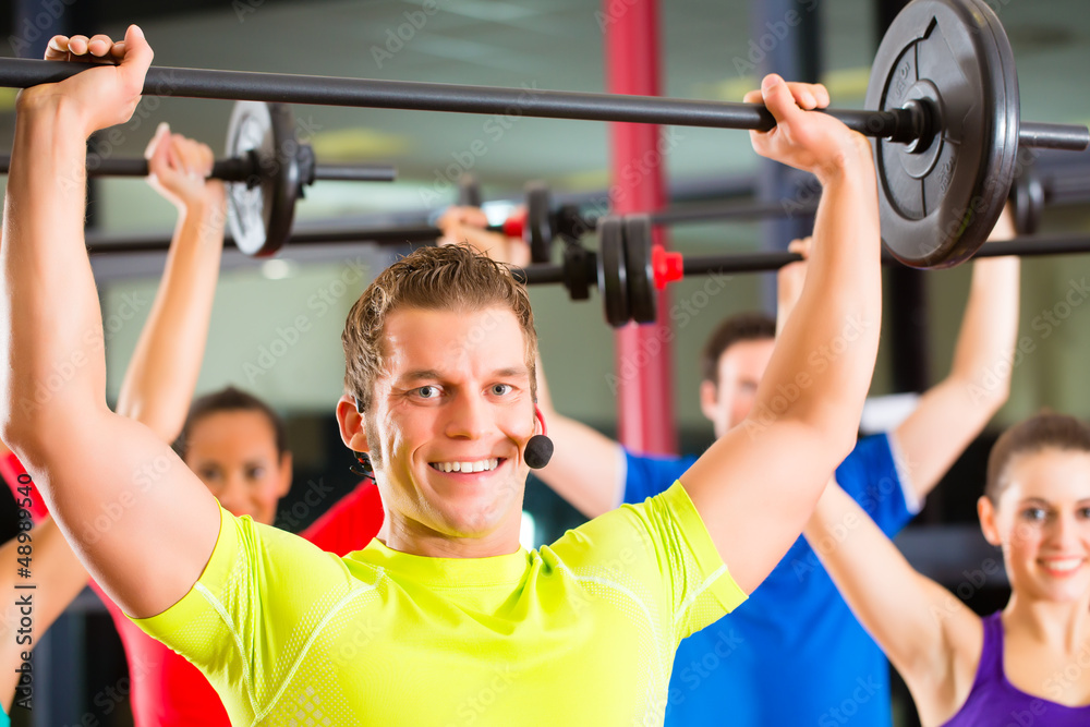 weight training in the gym with dumbbells weight training in the gym with dumbbells