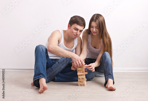 guy and girl building of tower