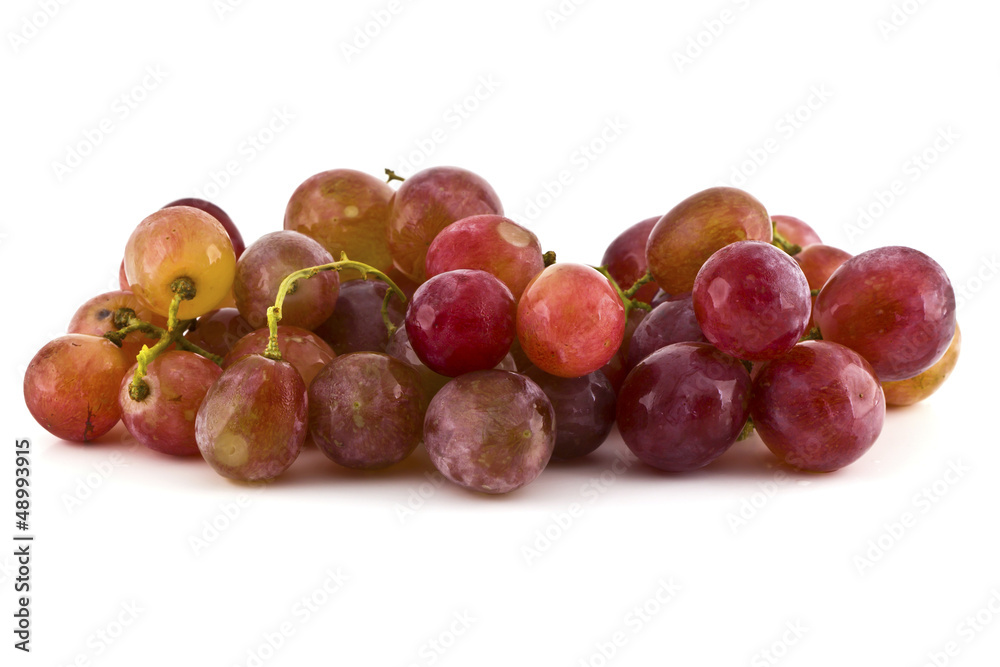 Close up of red grapes on white background with copy space. Close up of red grapes on white background with copy space.