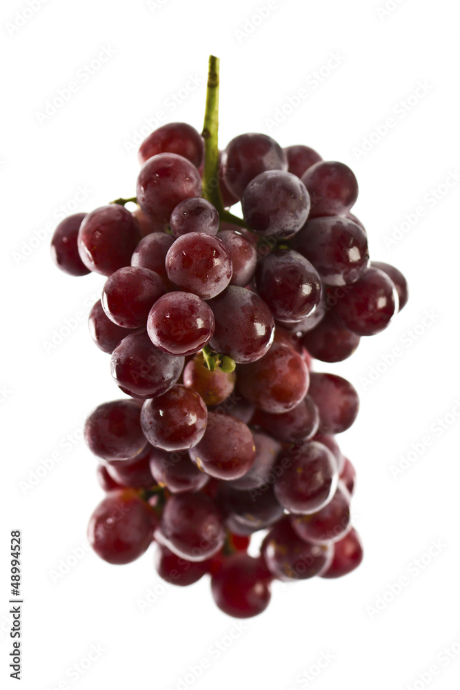 Close up of red grapes on white background with copy space.