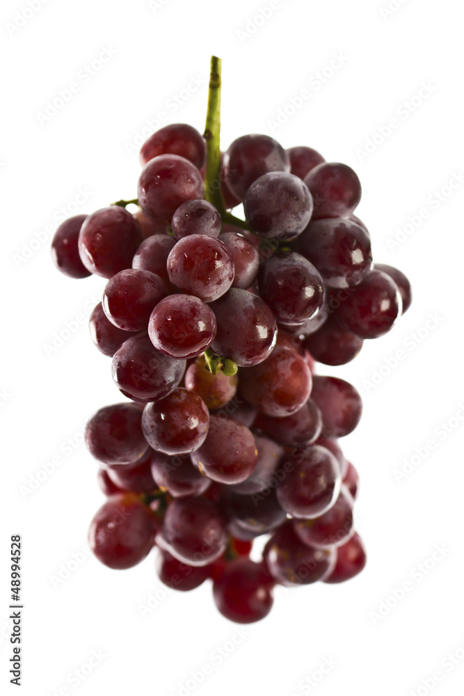 Close up of red grapes on white background with copy space. Close up of red grapes on white background with copy space.