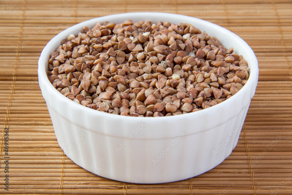 buckwheat in white ceramic cup buckwheat in white ceramic cup