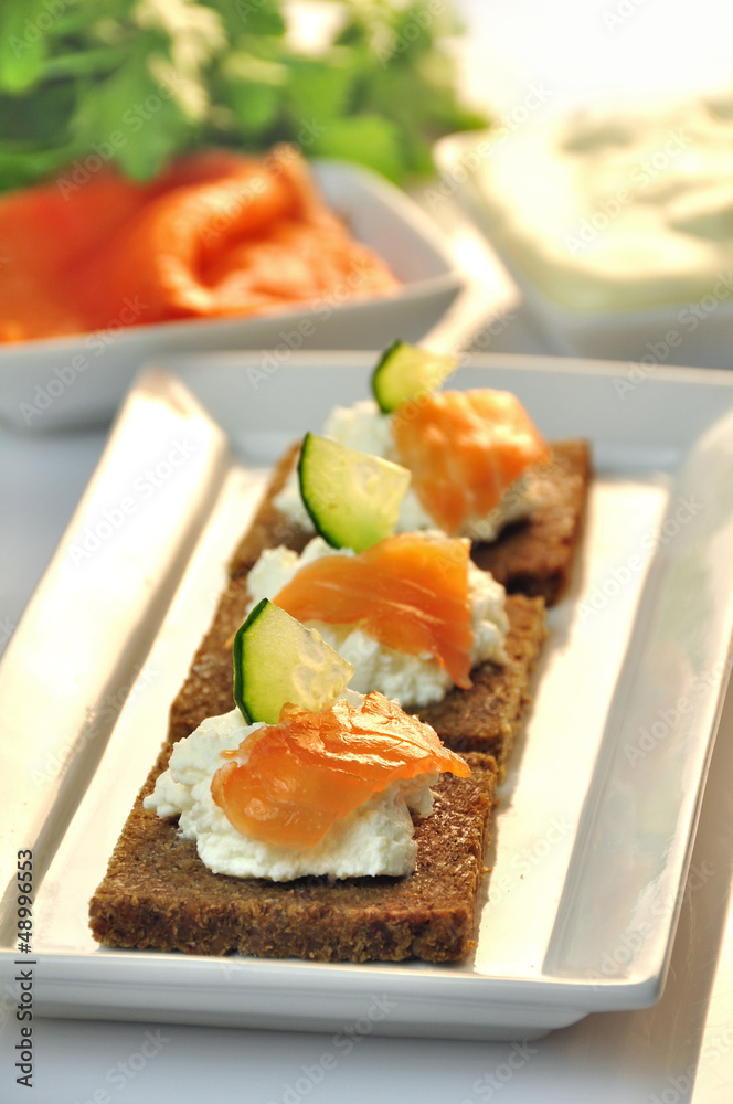 canapes rye bread with ricotta cheese and smoked salmon
