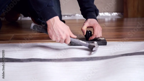 man works. installs laminate