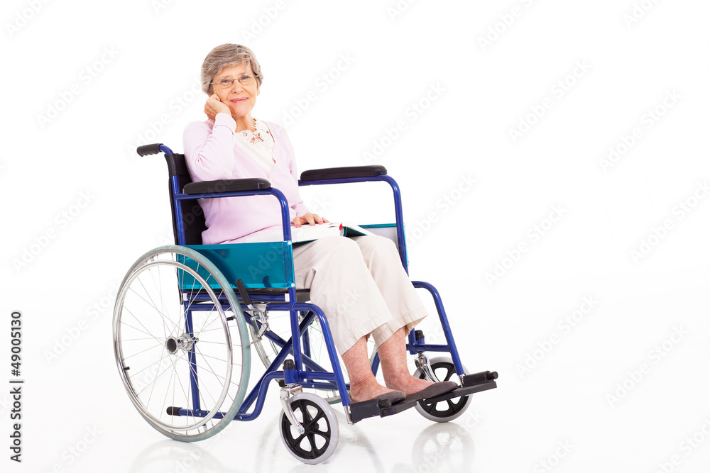 elegant senior woman sitting on wheelchair isolated on white elegant senior woman sitting on wheelchair isolated on white