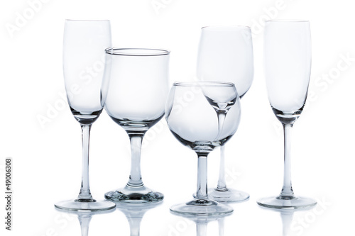 Different types of empty glasses on a white background