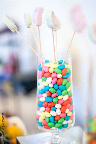 Colorful assortment of candy in a glass