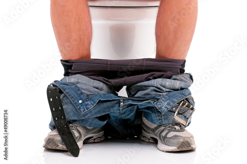 Man on toilet bowl photo