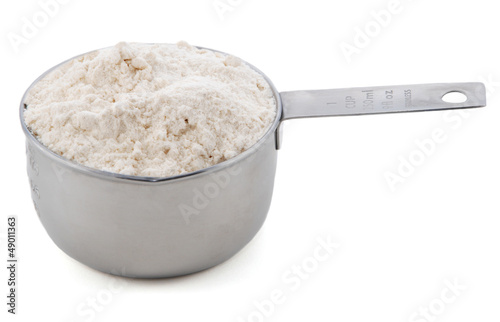 Plain / all purpose flour presented in a cup measure