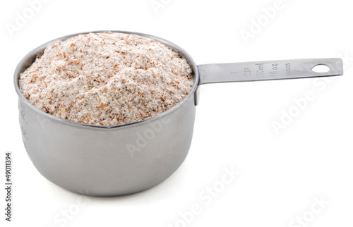 Wholemeal flour presented in a cup measure