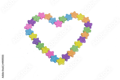 Conversation Hearts in the Shape of a Heart on a white backgroun