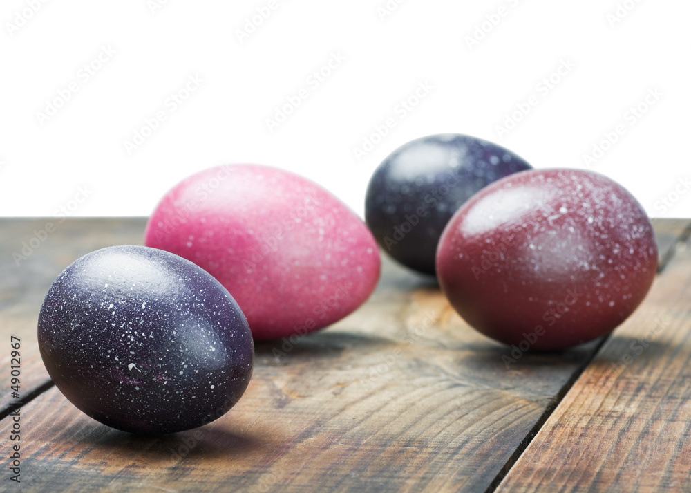 painted Easter eggs on wooden table isolated painted Easter eggs on wooden table isolated
