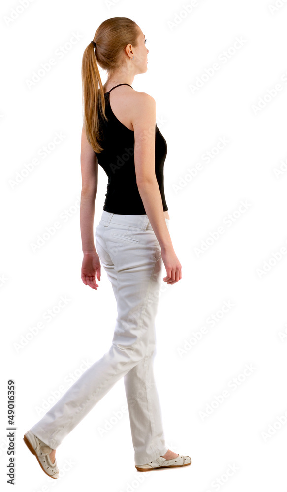 back view of walking  woman