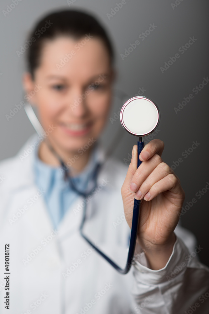 Female Doctor holding stethoscope (shallow Depth Of Field). Female Doctor holding stethoscope (shallow Depth Of Field).