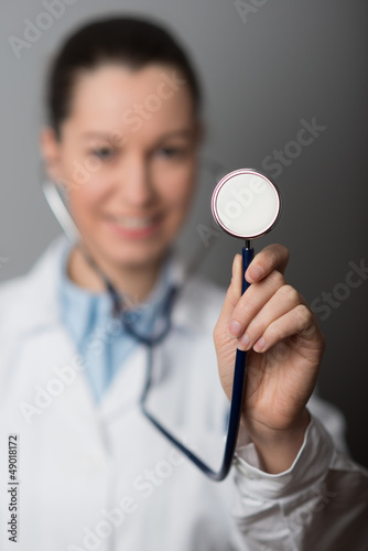 Female Doctor holding stethoscope (shallow Depth Of Field).