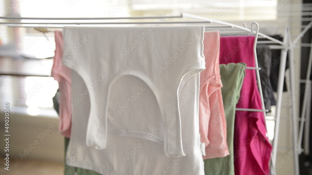 Hanging up washing on a clothes dryer