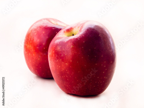 two red apple against white background