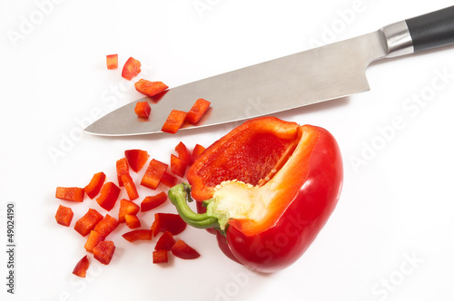 Leinwand Poster Messer mit Paprika auf weiss