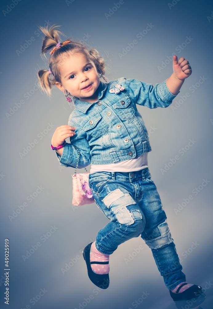 Funny little girl with small bag