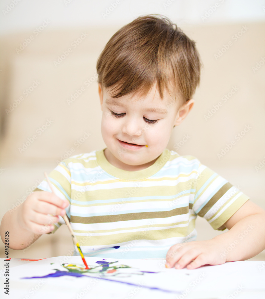 Little boy is playing with paints Little boy is playing with paints