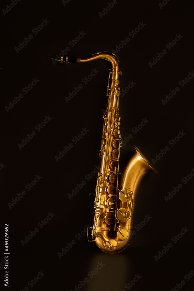 Obraz premium Sax golden tenor saxophone in black