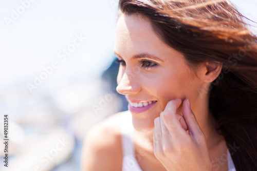 happy young woman face closeup outdoors