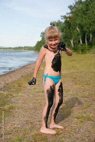 Girl on the lake Uchum smeared mud