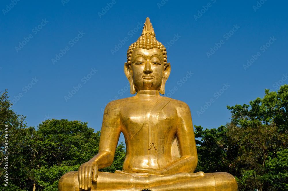 Golden Buddha statue at temple of Thailand